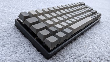 A picture of my black aluminium keyboard with blank grey keycaps.